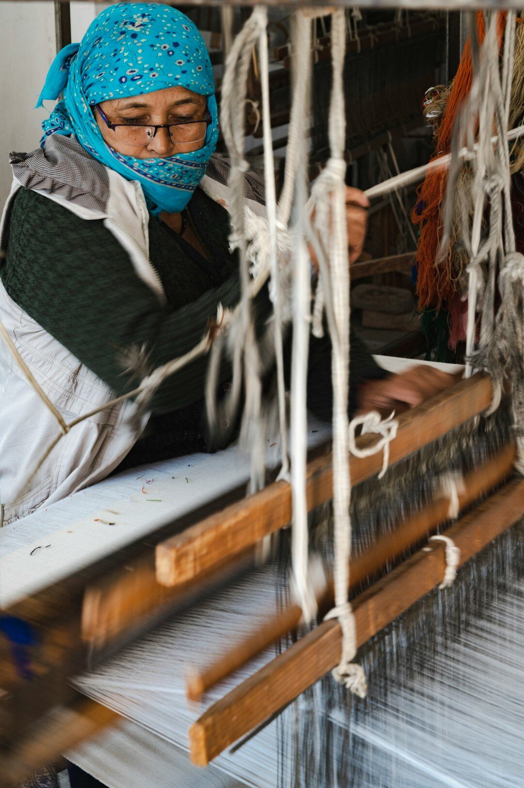woman weaving textile